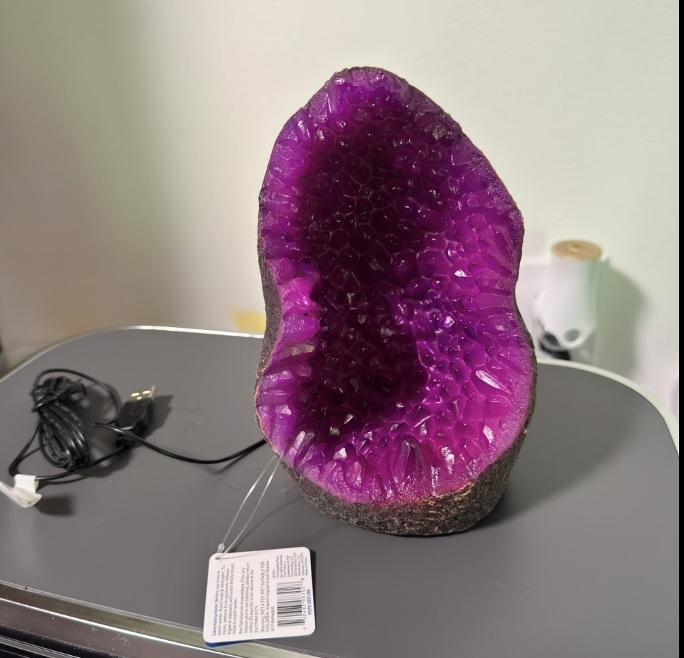 Purple faux geode aquarium decoration from a Pet Supplies Plus swag box